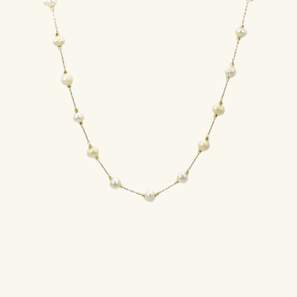 Elegant freshwater pearl necklace on a dainty gold chain, a timeless jewellery piece perfect for bridesmaids, weddings, or meaningful everyday wear.