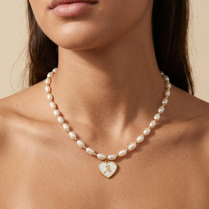 Premium freshwater rice pearl and 14K gold filled beaded necklace with personalised heart shaped mother of shell initial charm, hand-finished in Australia