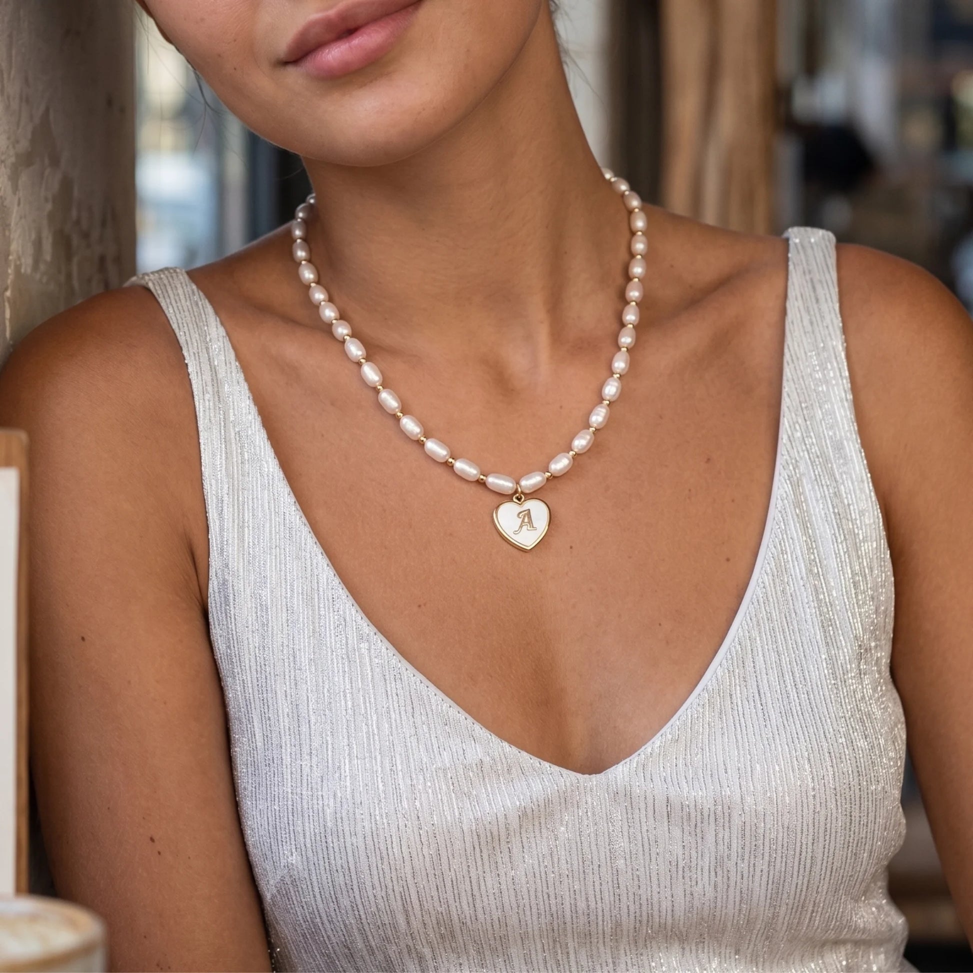 Premium freshwater rice pearl and 14K gold filled beaded necklace with personalised heart shaped mother of shell initial charm, hand-finished in Australia