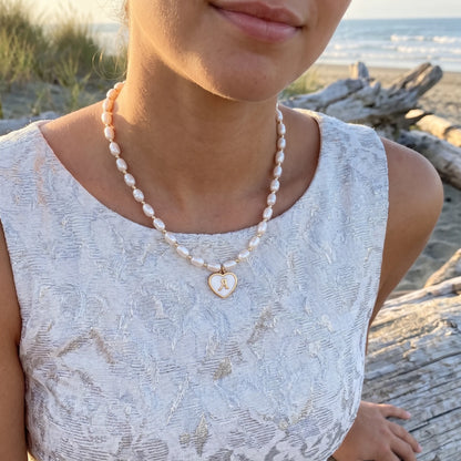 Premium freshwater rice pearl and 14K gold filled beaded necklace with personalised heart shaped mother of shell initial charm, hand-finished in Australia