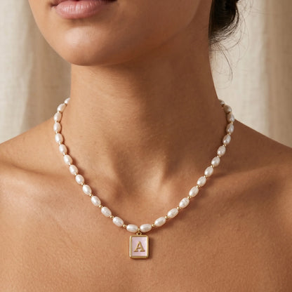 Premium freshwater rice pearl and 14K gold filled beaded necklace with personalised pink mother of shell initial charm, hand-finished in Australia