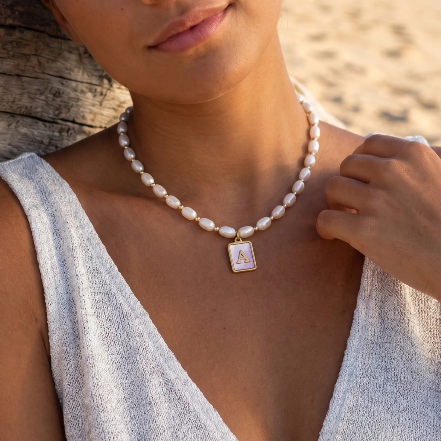 Premium freshwater rice pearl and 14K gold filled beaded necklace with personalised pink mother of shell initial charm, hand-finished in Australia