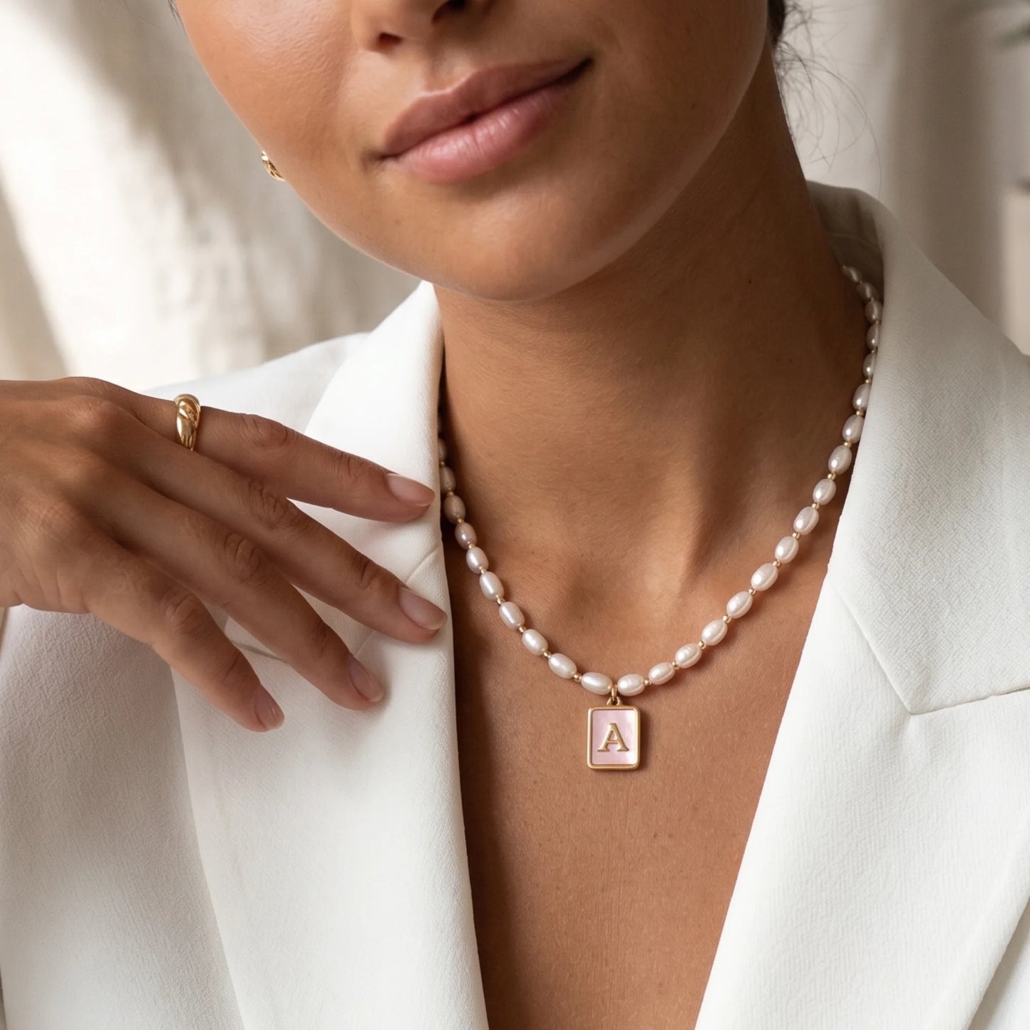 Premium freshwater rice pearl and 14K gold filled beaded necklace with personalised pink mother of shell initial charm, hand-finished in Australia