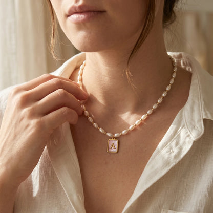Premium freshwater rice pearl and 14K gold filled beaded necklace with personalised pink mother of shell initial charm, hand-finished in Australia