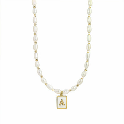 Premium freshwater rice pearl and 14K gold filled beaded necklace with personalised mother of shell initial charm, hand-finished in Australia