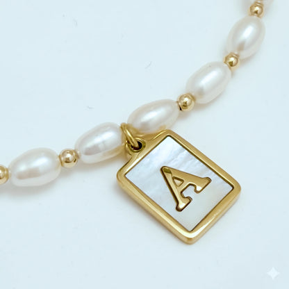 Premium freshwater rice pearl and 14K gold filled beaded necklace with personalised mother of shell initial charm, hand-finished in Australia