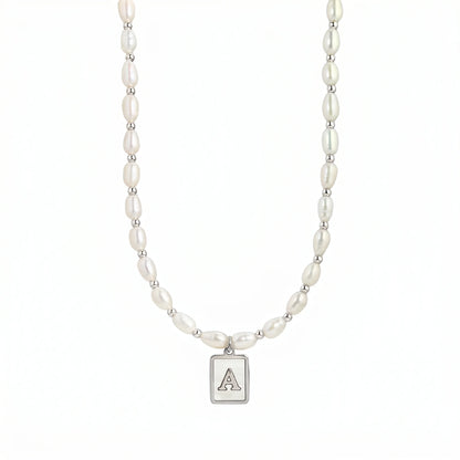 Premium freshwater rice pearl and 925 sterling silver beaded necklace with personalised mother of shell initial charm, hand-finished in Australia