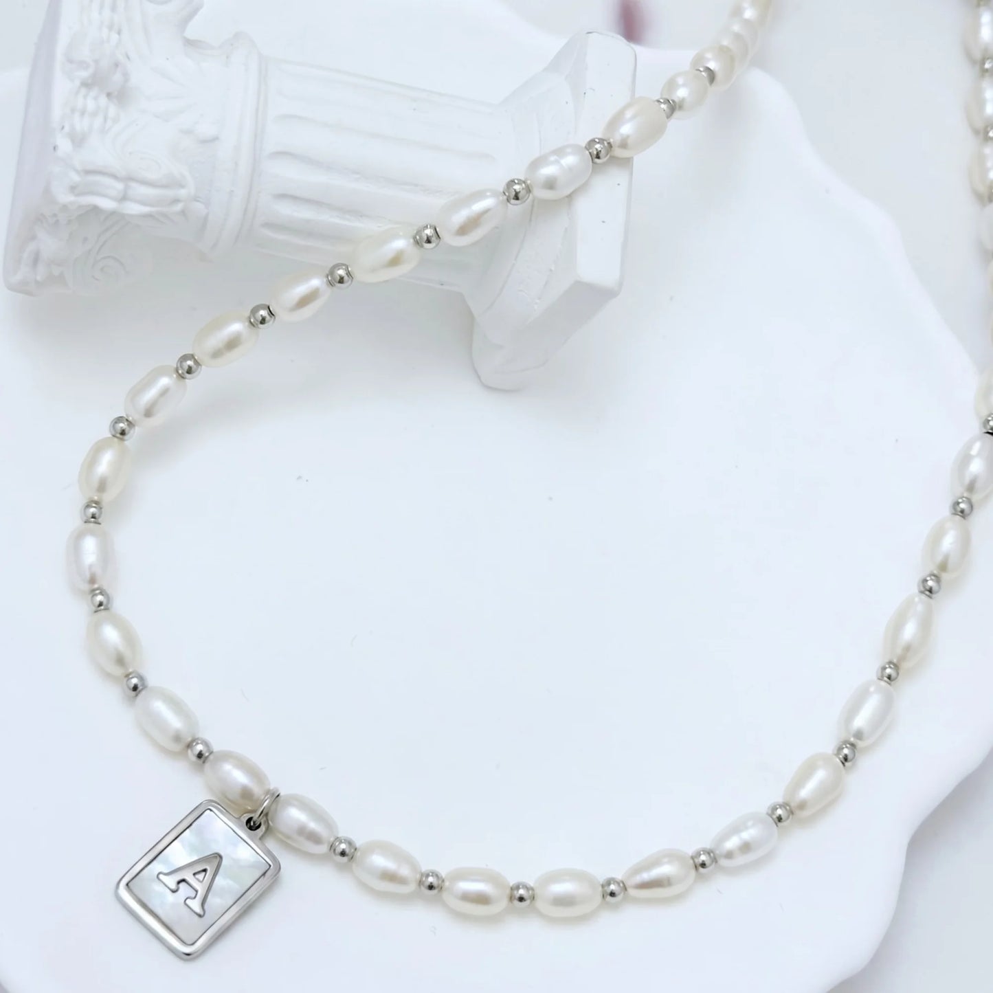 Premium freshwater rice pearl and 925 sterling silver beaded necklace with personalised mother of shell initial charm, hand-finished in Australia