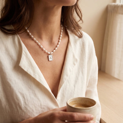 Premium freshwater rice pearl and 925 sterling silver beaded necklace with personalised mother of shell initial charm, hand-finished in Australia
