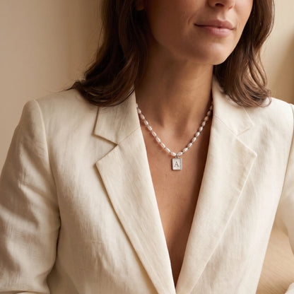 Premium freshwater rice pearl and 925 sterling silver beaded necklace with personalised mother of shell initial charm, hand-finished in Australia