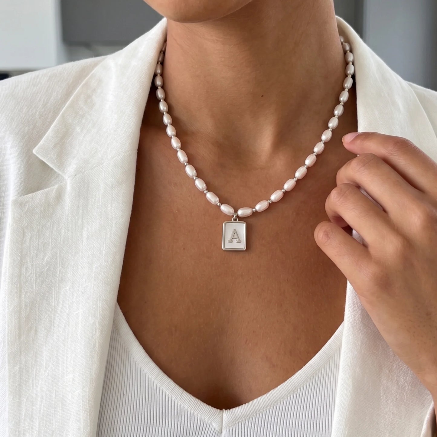 Premium freshwater rice pearl and 925 sterling silver beaded necklace with personalised mother of shell initial charm, hand-finished in Australia