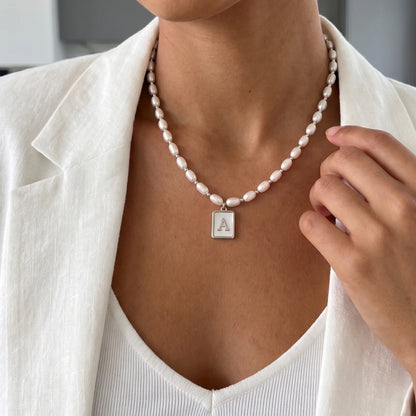 Premium freshwater rice pearl and 925 sterling silver beaded necklace with personalised mother of shell initial charm, hand-finished in Australia