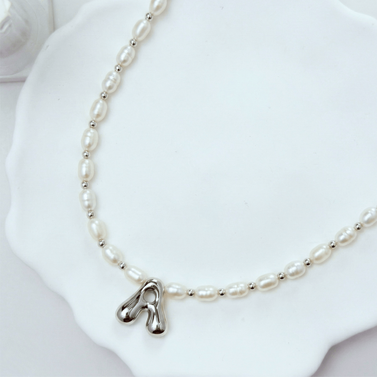 Premium freshwater rice pearl and 925 sterling silver beaded necklace with personalised bubble initial charm, hand-finished in Australia