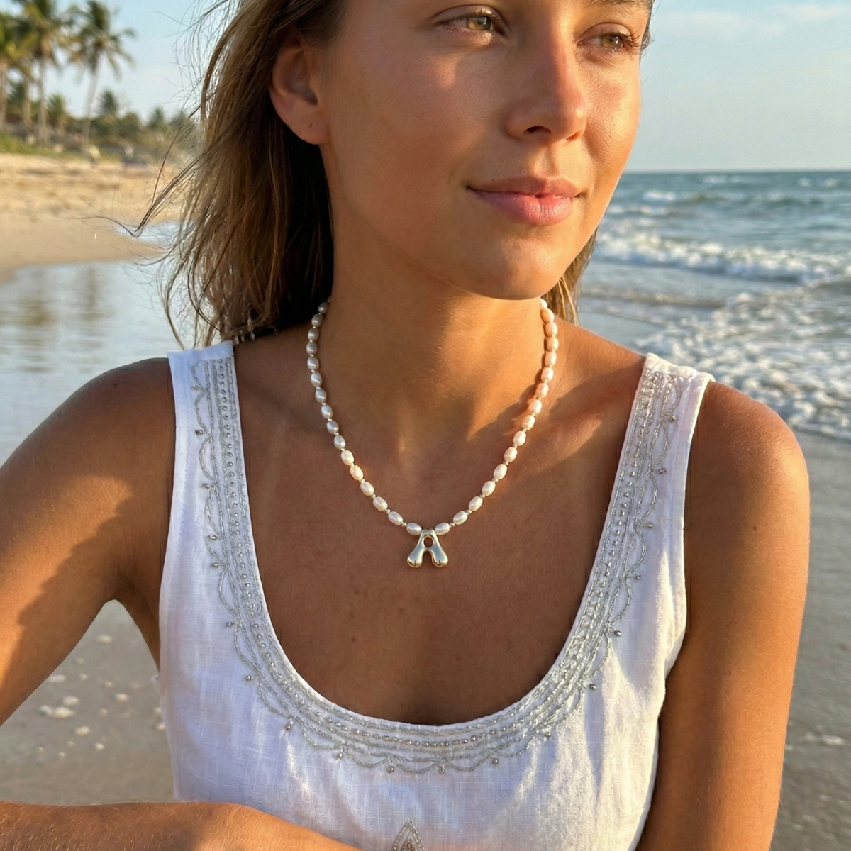 Premium freshwater rice pearl and 925 sterling silver beaded necklace with personalised bubble initial charm, hand-finished in Australia