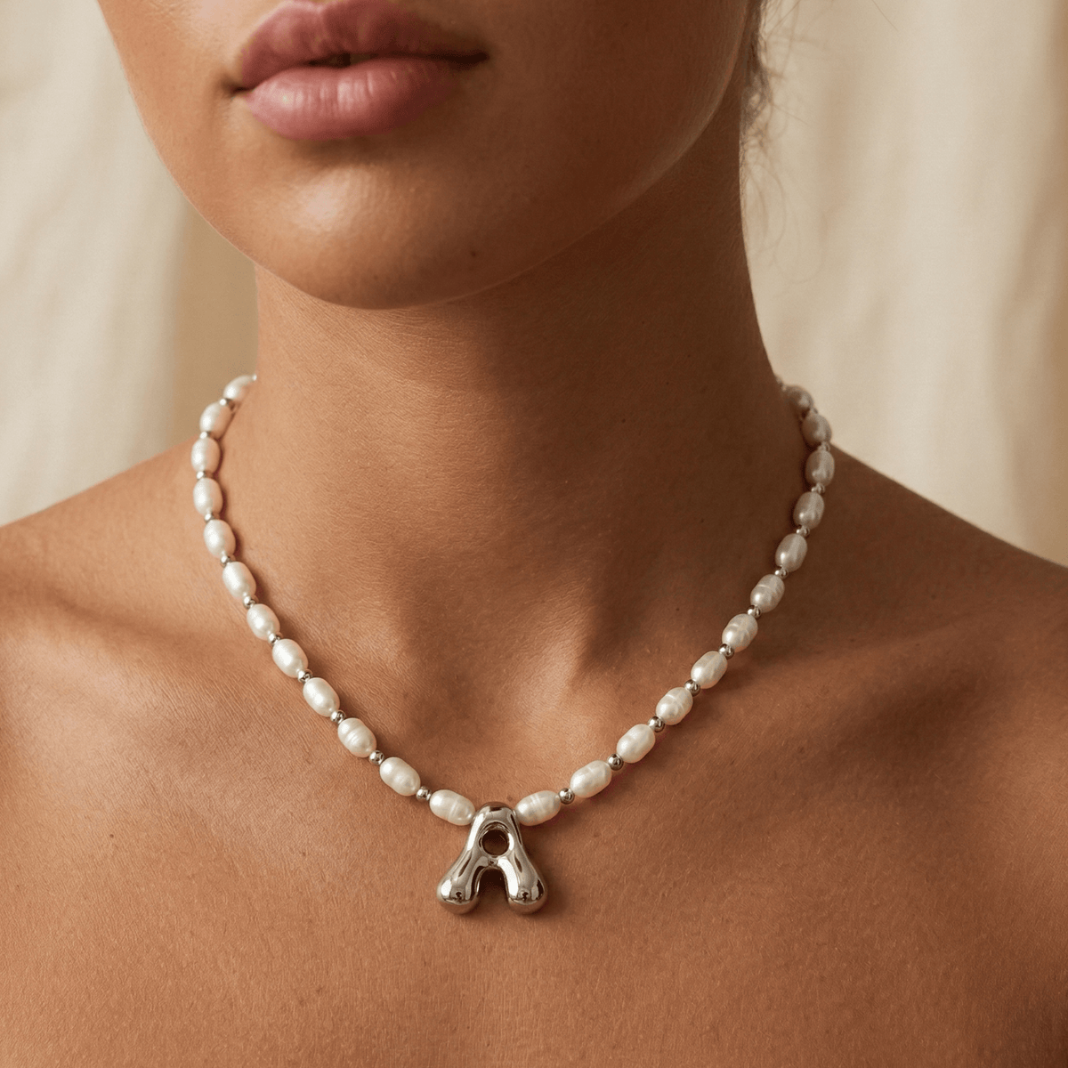 Premium freshwater rice pearl and 925 sterling silver beaded necklace with personalised bubble initial charm, hand-finished in Australia