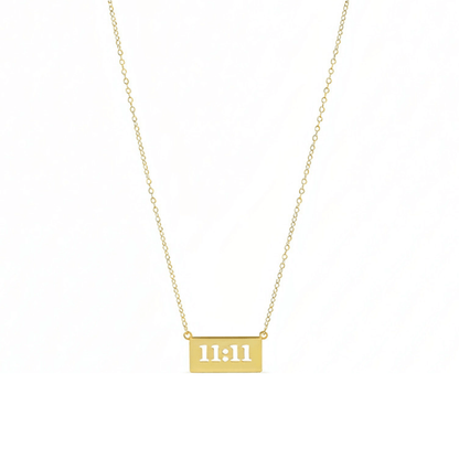 Gold 11:11 angel number necklace featuring a rectangular pendant on a dainty chain, symbolising manifestation and alignment.