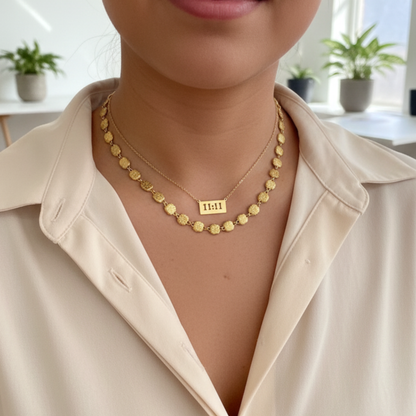 Gold 11:11 angel number necklace featuring a rectangular pendant on a dainty chain, symbolising manifestation and alignment.