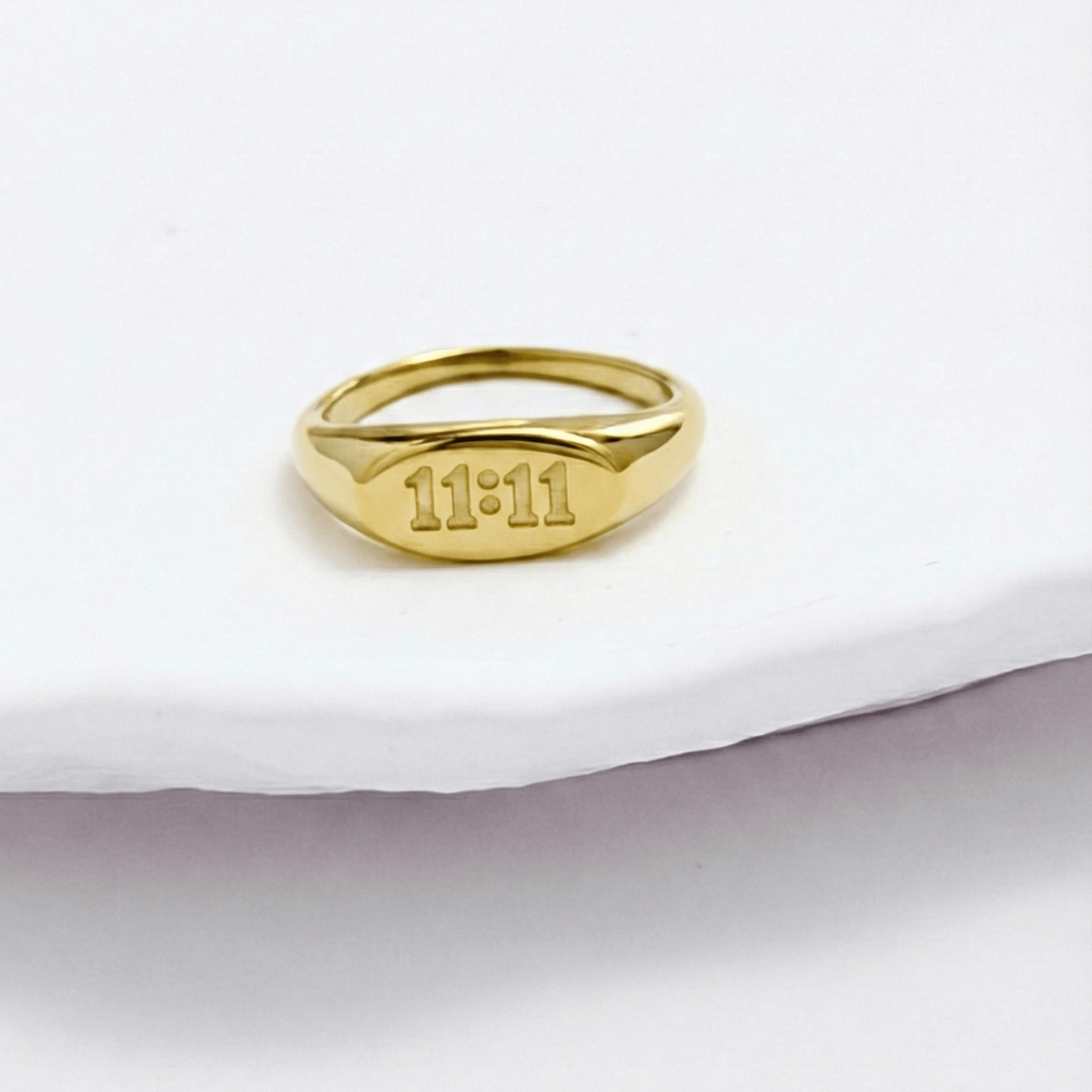 Gold 11:11 Signet Ring with oval face embossed with angel numbers by MXW Jewellery