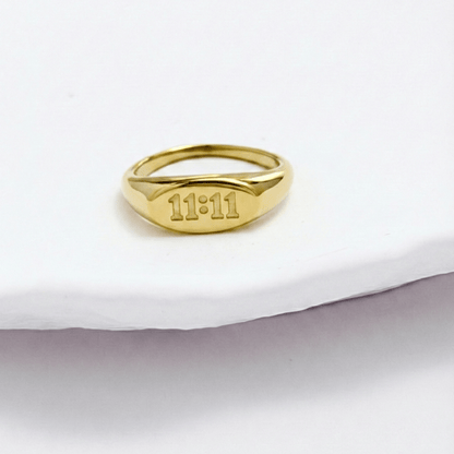 Gold 11:11 Signet Ring with oval face embossed with angel numbers by MXW Jewellery