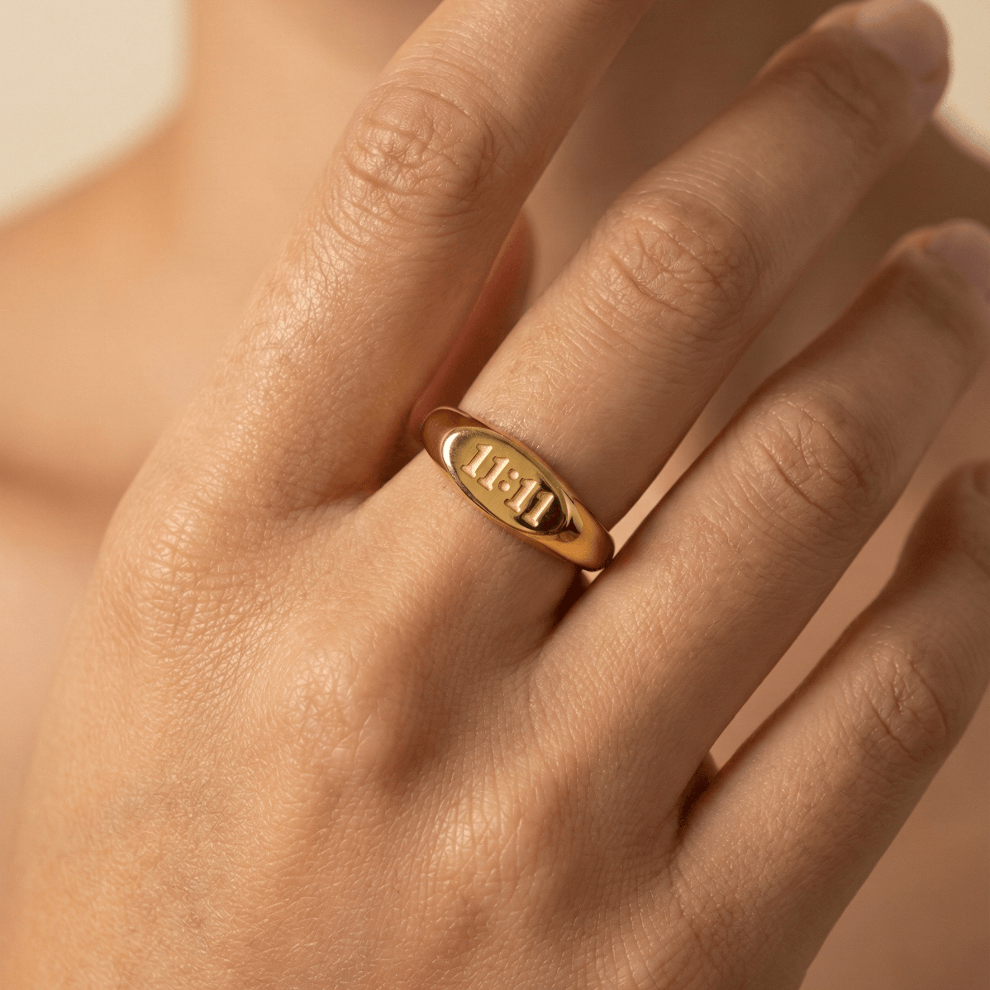 Gold 11:11 Signet Ring with oval face embossed with angel numbers by MXW Jewellery