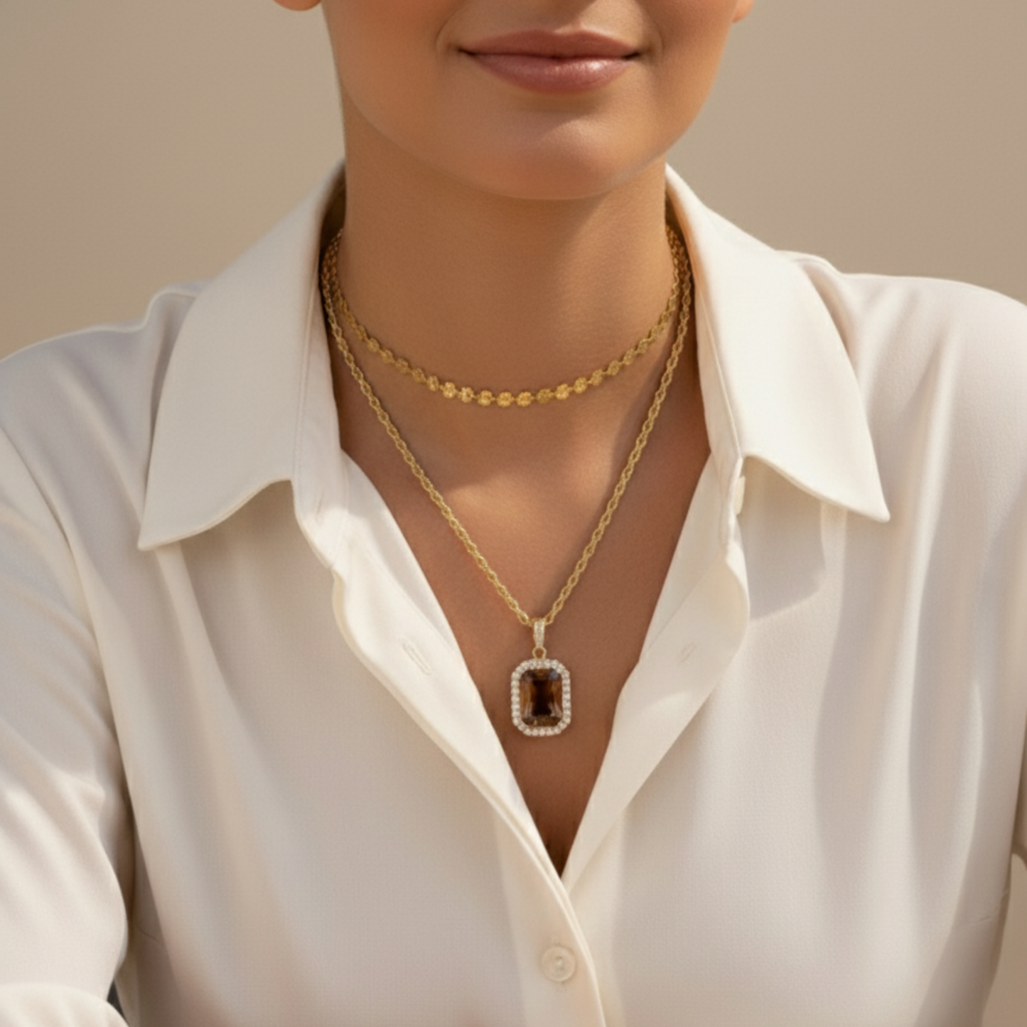 Gold Amber Halo Necklace featuring a rectangular amber zircon surrounded by halo crystals on a gold rope chain.