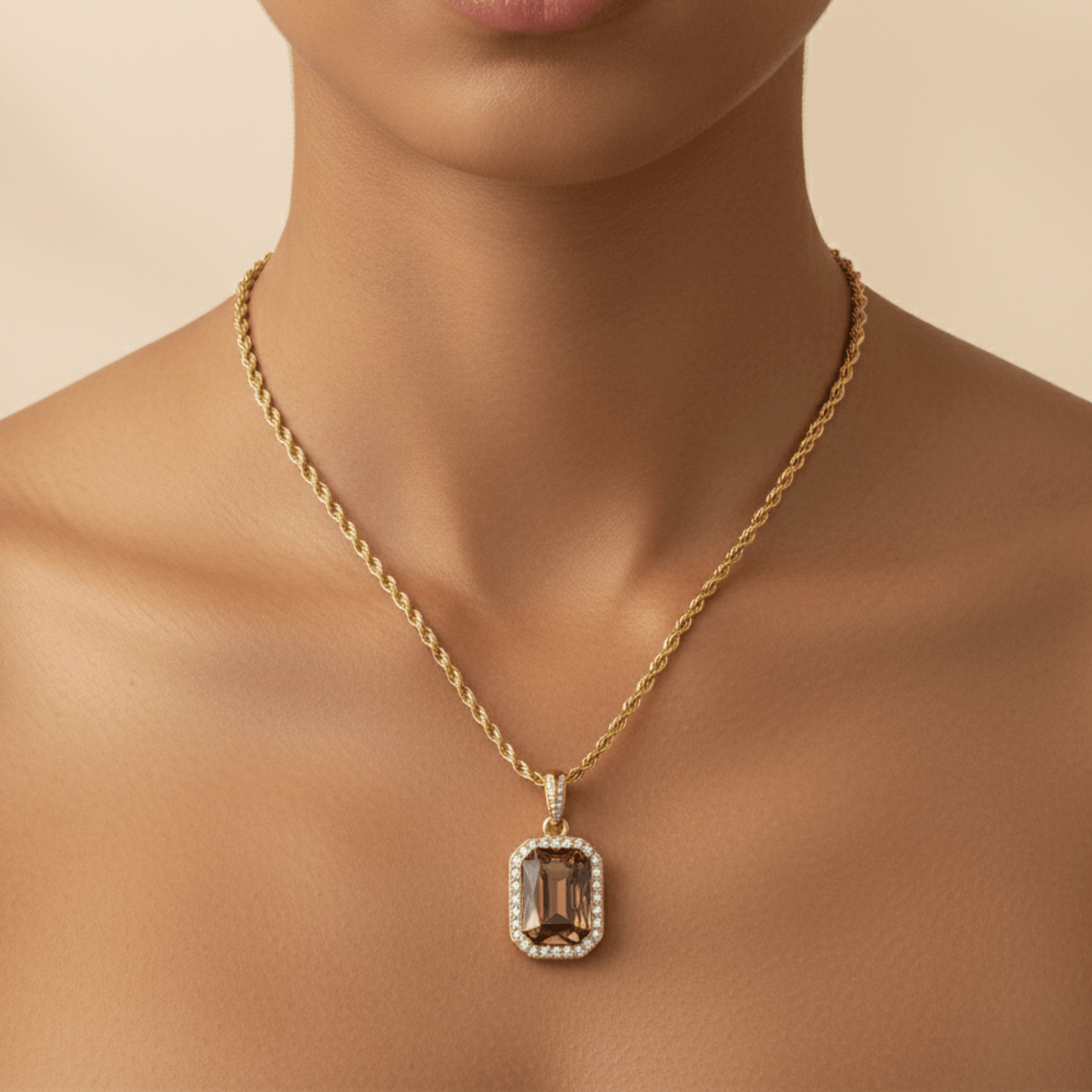 Gold Amber Halo Necklace featuring a rectangular amber zircon surrounded by halo crystals on a gold rope chain.