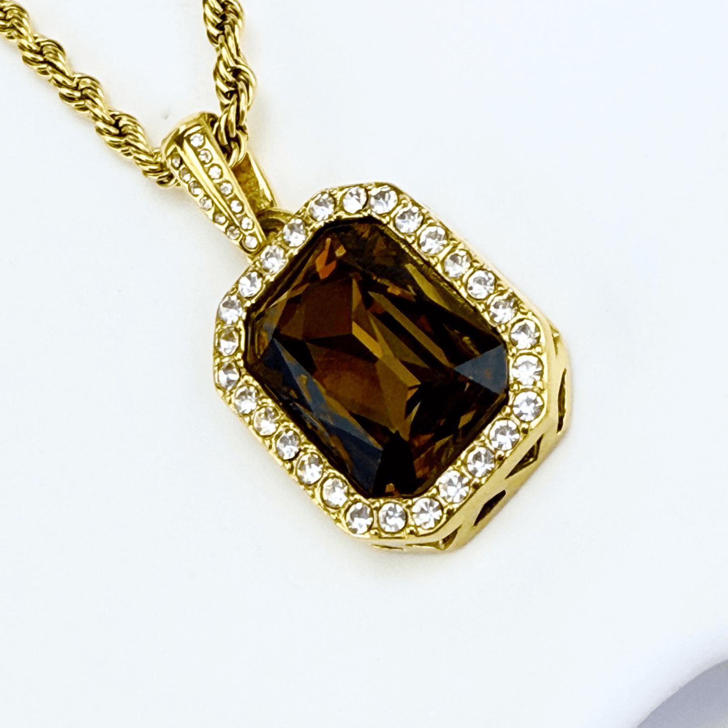 Gold Amber Halo Necklace featuring a rectangular amber zircon surrounded by halo crystals on a gold rope chain.