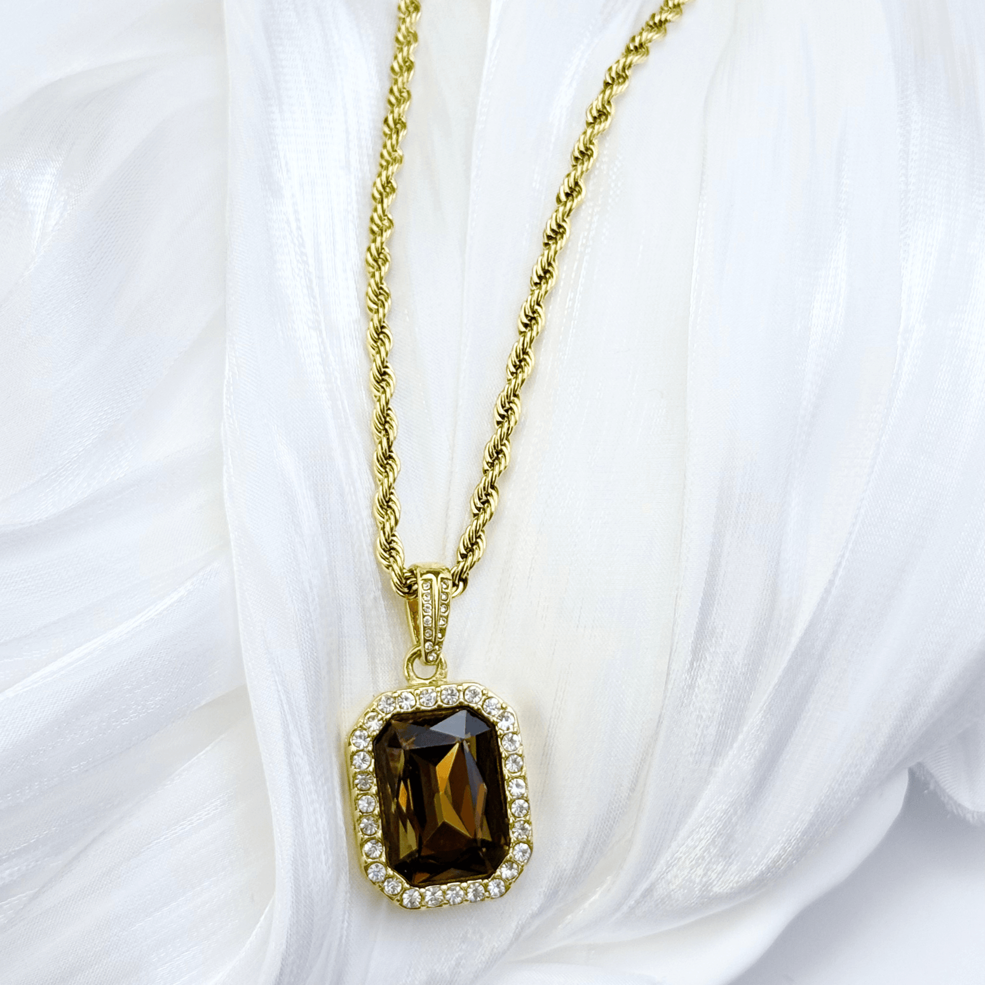 Gold Amber Halo Necklace featuring a rectangular amber zircon surrounded by halo crystals on a gold rope chain.