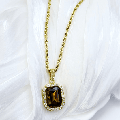 Gold Amber Halo Necklace featuring a rectangular amber zircon surrounded by halo crystals on a gold rope chain.
