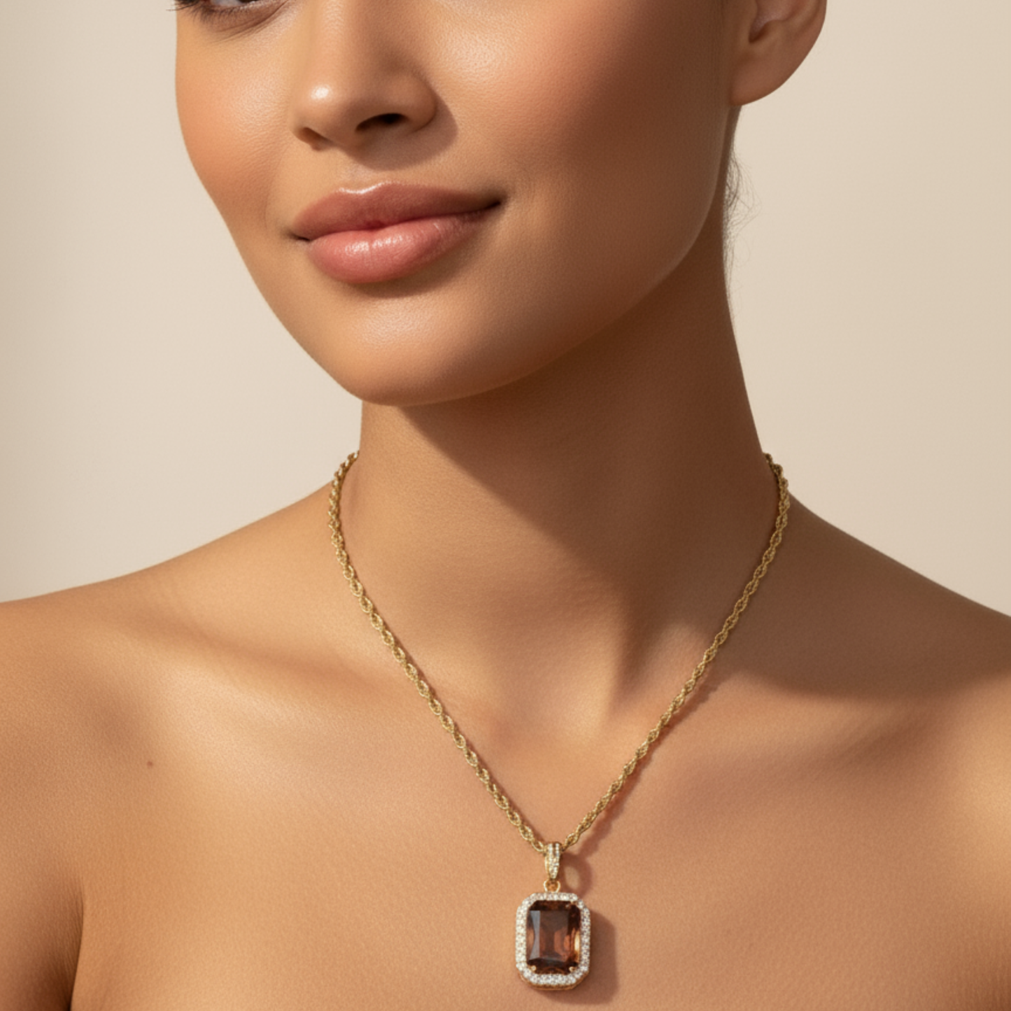 Gold Amber Halo Necklace featuring a rectangular amber zircon surrounded by halo crystals on a gold rope chain.