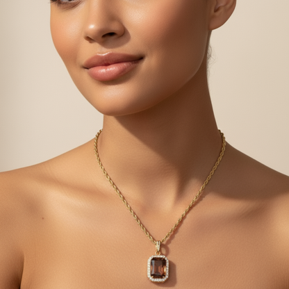 Gold Amber Halo Necklace featuring a rectangular amber zircon surrounded by halo crystals on a gold rope chain.