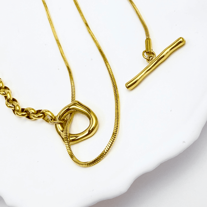 gold asymmetric T-bar lariat necklace with mixed chain design