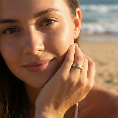 Gold Baguette Spinner Ring by MXW Jewellery featuring a rotating band set with clear rectangular crystals.