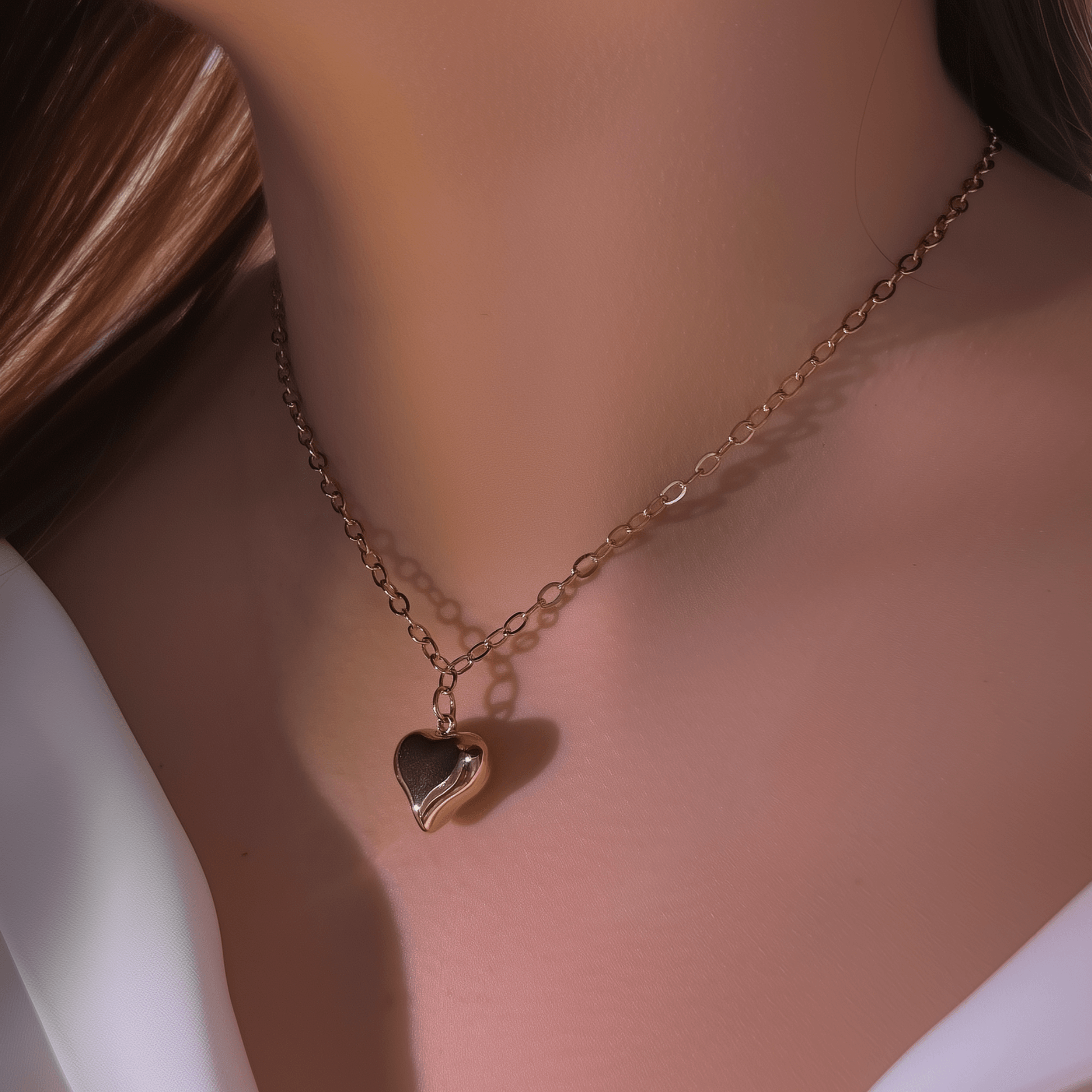 Gold chunky heart pendant necklace on model, waterproof and bold statement design