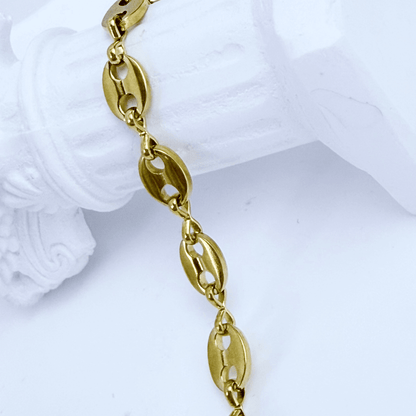 Gold coffee bean chain bracelet with sculpted oval links.