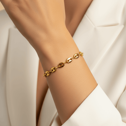 Gold coffee bean chain bracelet with sculpted oval links.