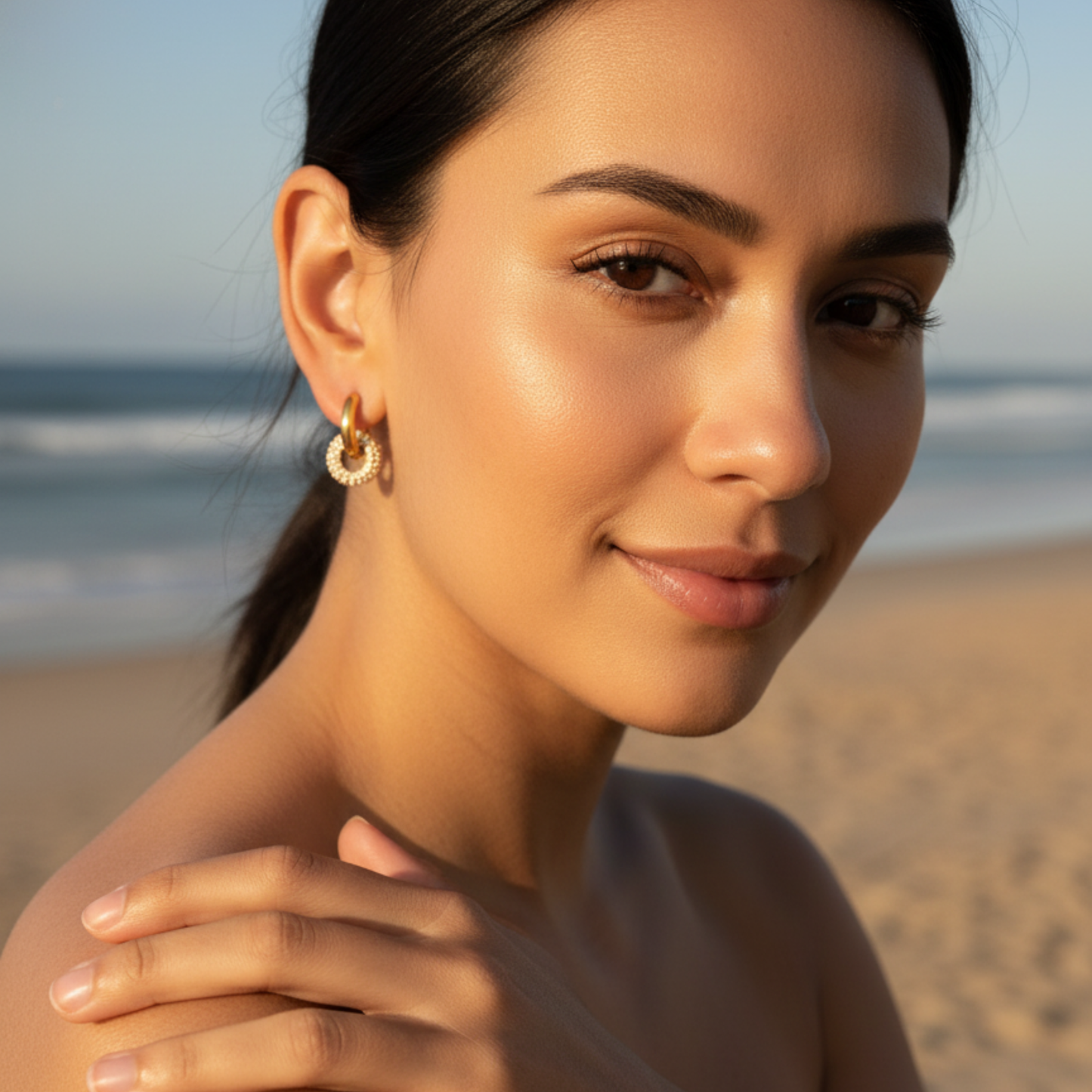 Gold crystal halo drop earrings with pavé circle and gold huggie hoop, waterproof and tarnish-resistant design.