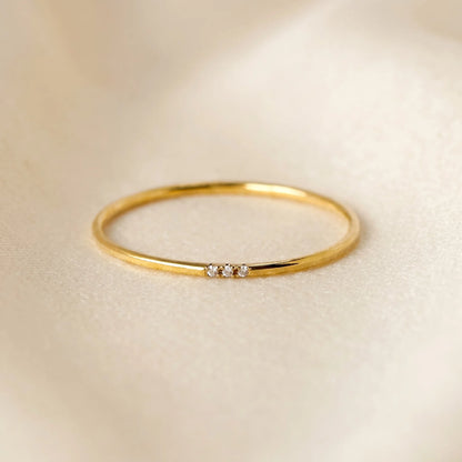 Dainty 14K gold filled stacking ring with three clear cubic zirconia stones
