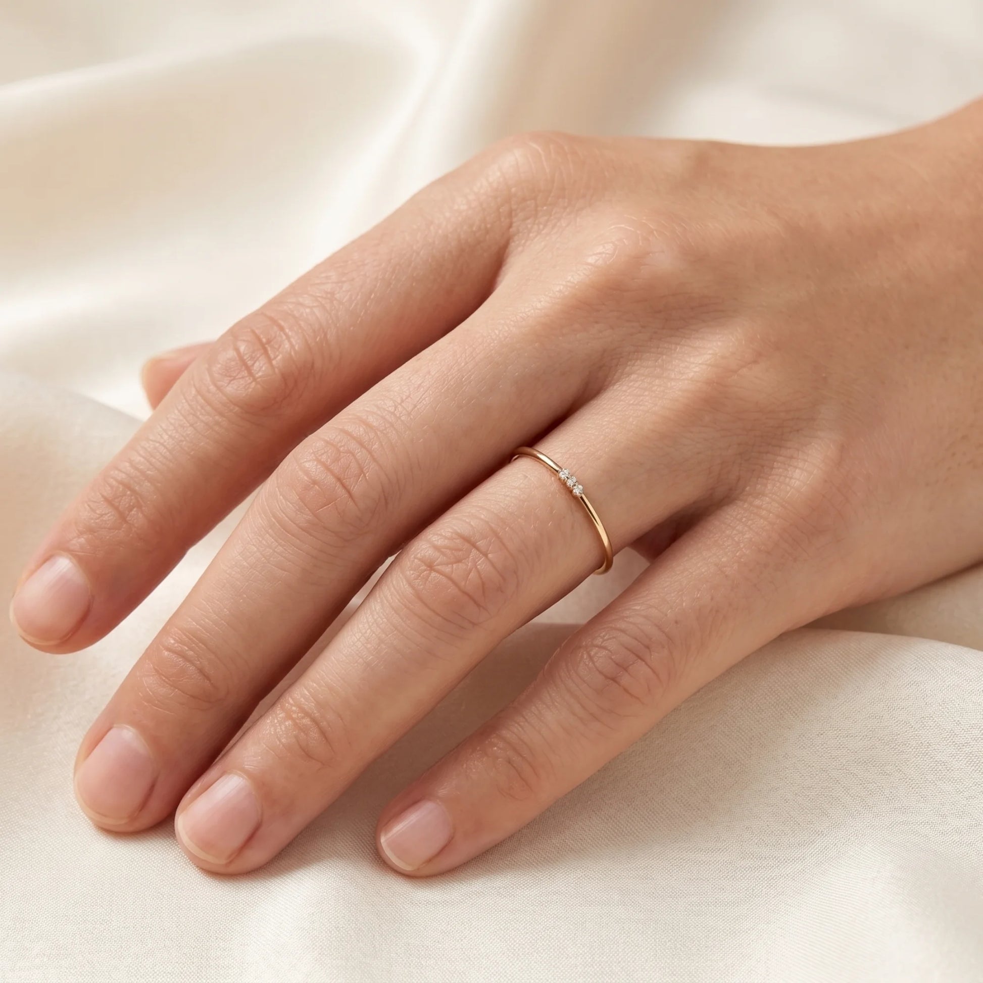 Dainty 14K gold filled stacking ring with three clear cubic zirconia stones