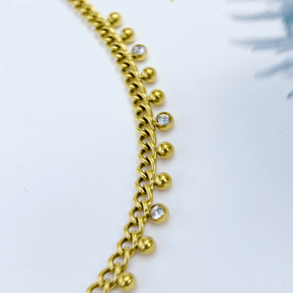 Elegant gold necklace featuring dotted zircon charms on a fine waterproof chain