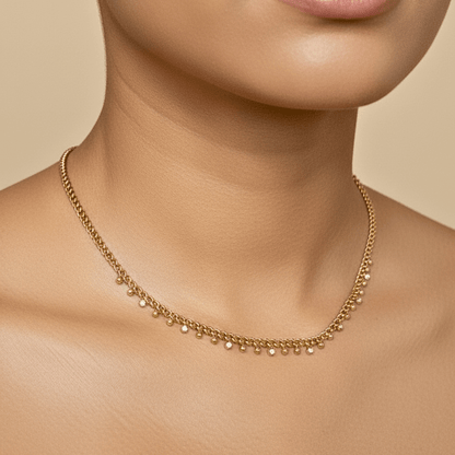 Elegant gold necklace featuring dotted zircon charms on a fine waterproof chain