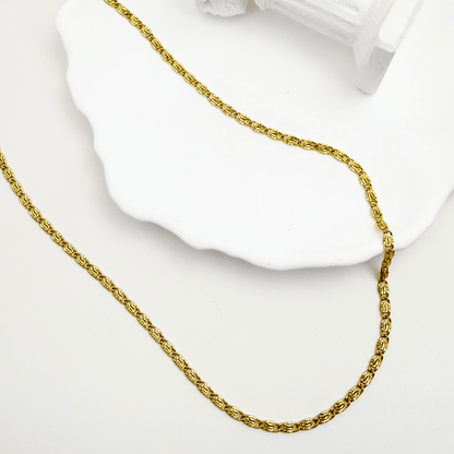 gold 3 mm dragon link chain necklace with interlocking links and polished finish on white background