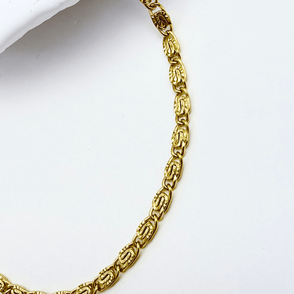 gold 3 mm dragon link chain necklace with interlocking links and polished finish on white background