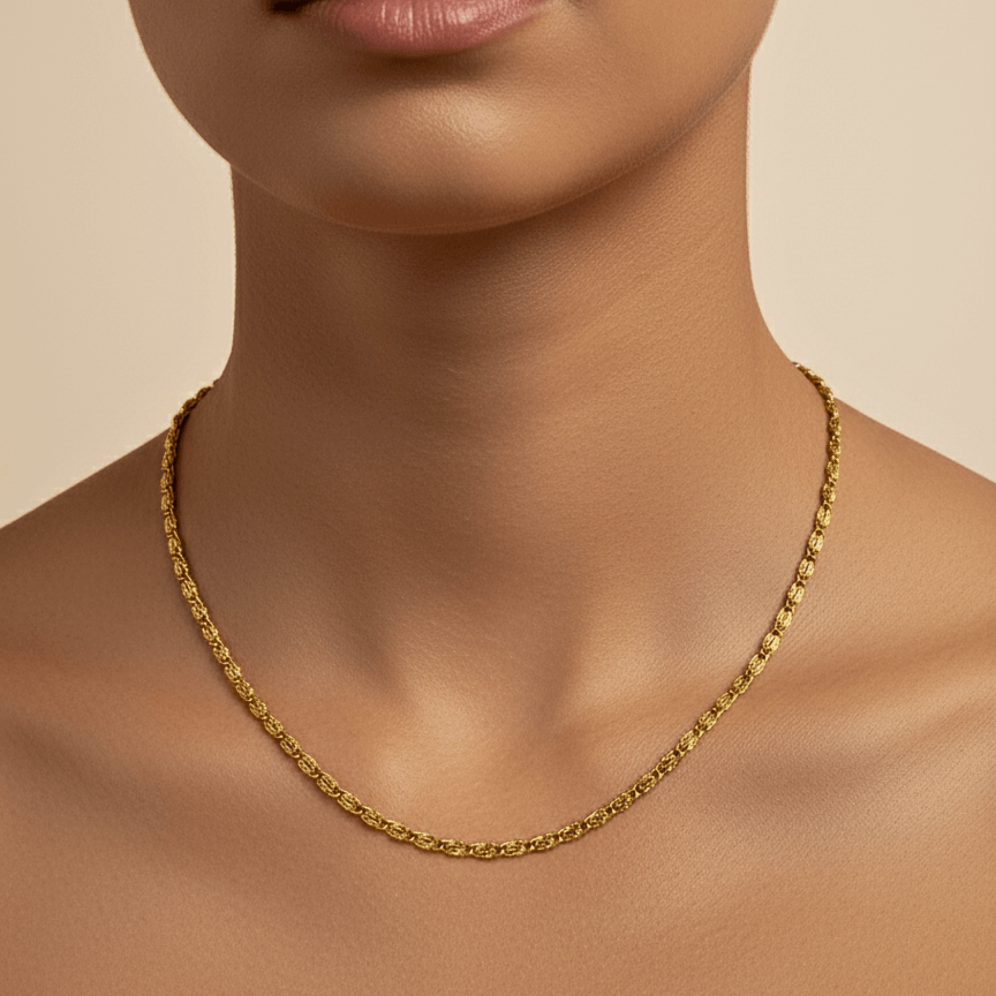 gold 3 mm dragon link chain necklace with interlocking links and polished finish on white background