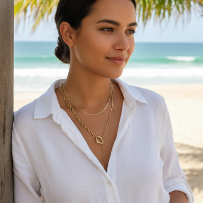 gold 3 mm dragon link chain necklace with interlocking links and polished finish on white background