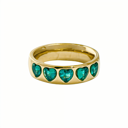 Gold Emerald Green Heart Ring by MXW Jewellery featuring a chunky gold band with flush-set emerald-hued heart stones