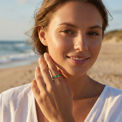 Gold Emerald Green Heart Ring by MXW Jewellery featuring a chunky gold band with flush-set emerald-hued heart stones