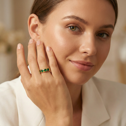 Gold Emerald Green Heart Ring by MXW Jewellery featuring a chunky gold band with flush-set emerald-hued heart stones