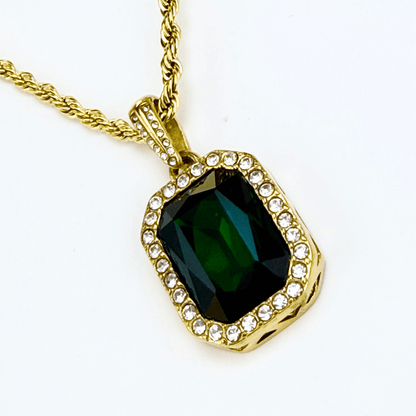 Gold emerald halo necklace featuring rectangular green zircon pendant on gold rope chain.