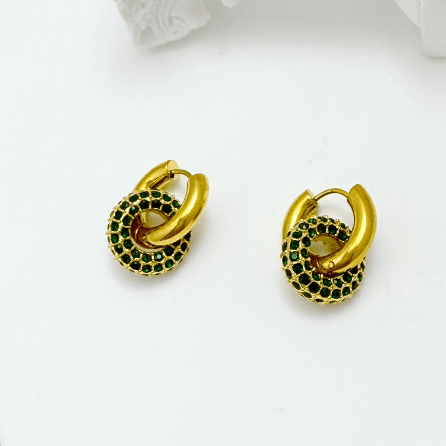 gold emerald pavé drop earrings with crystal halo circle hanging from gold huggies